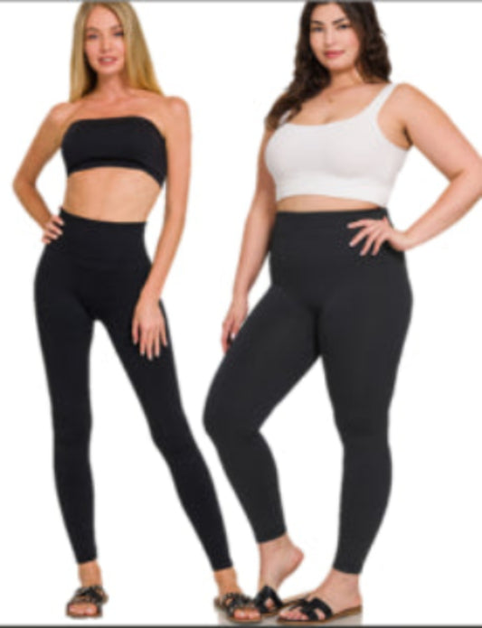 Two models wearing fleece lined leggings. One model is wearing a black sports bra and the other is wearing a white sports top.
